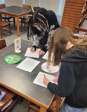 Students giving peer feedback